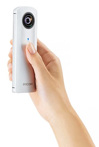 Hand holding theta camera