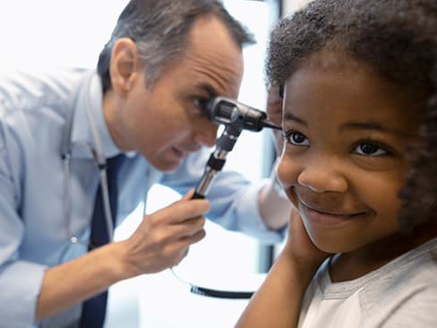 doctor evaluating child patient