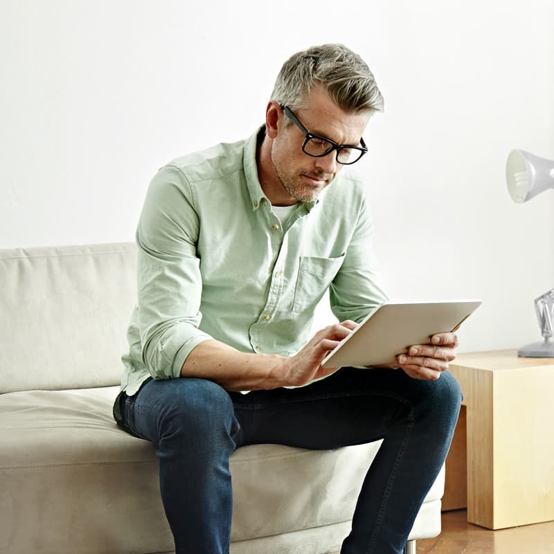 man reading content on a mobile device