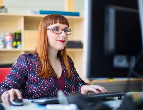 Woman working at a computer