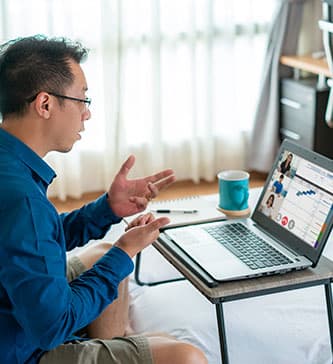 man conducting video conference with screensharing