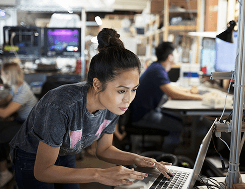 Rapid prototyping additive manufacturing lab - woman using laptop