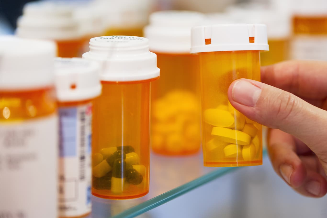 Pill bottles on shelf.