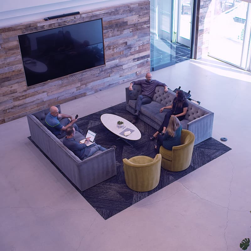 Manley Des and Kochalski Office with team members sitting and working in a common area