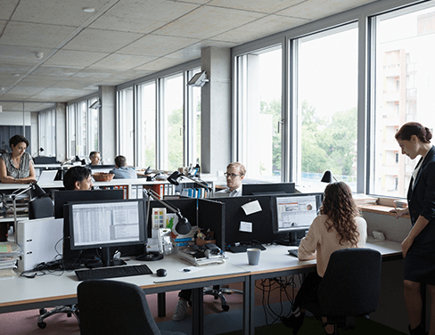 People working on computers in an office.