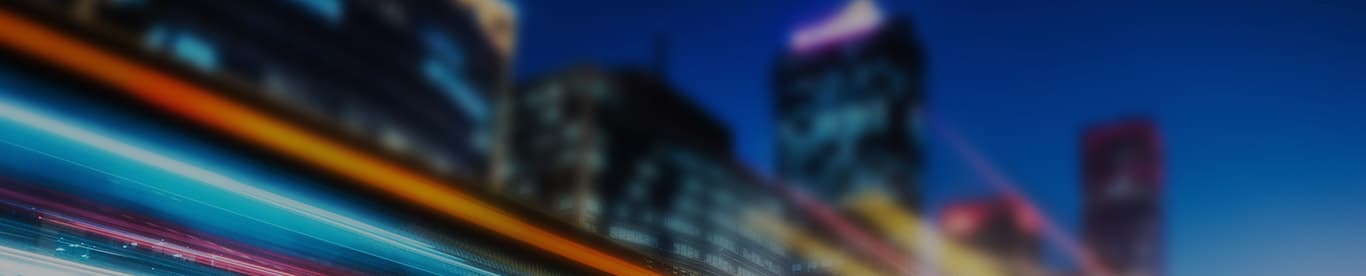 image of blurred car lights speeding down a city street