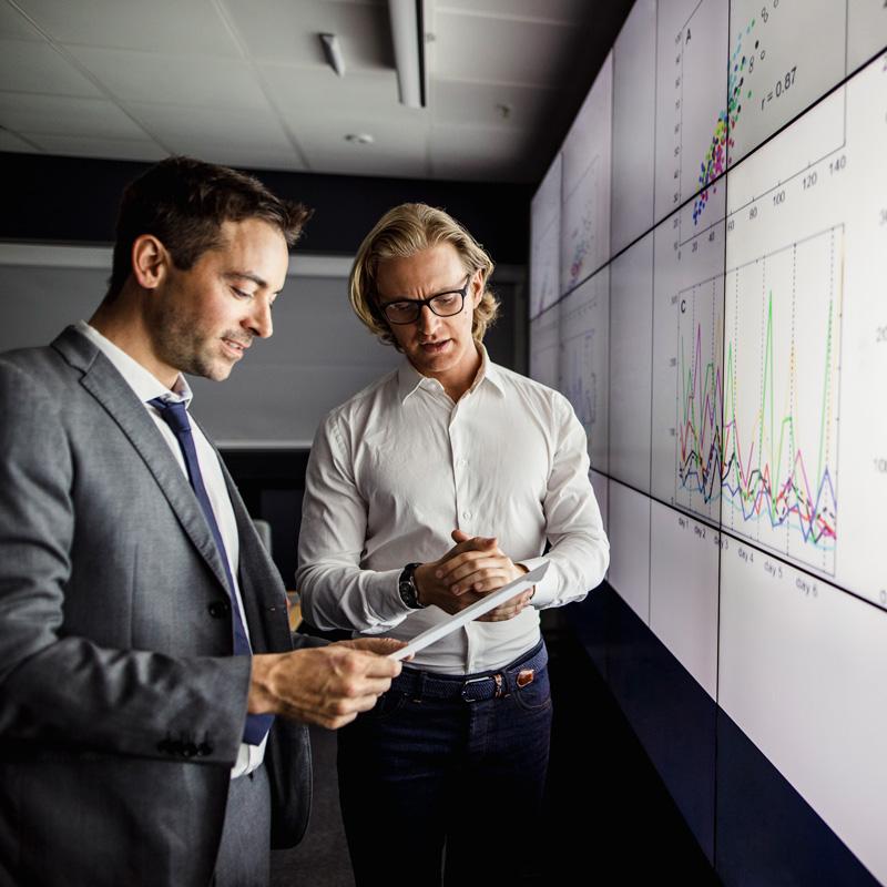 two men reviewing data