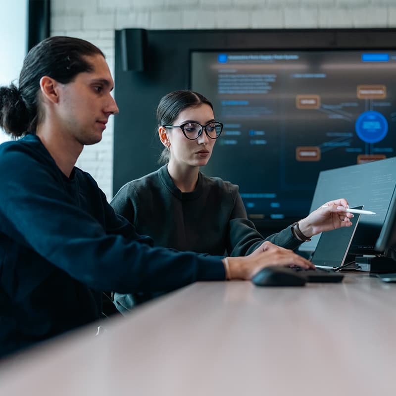 Professionals working, demonstrating centralized services providing hardware, application, and information technology support to our customers and team members.