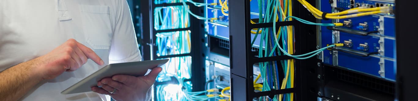 Technician working in server room.