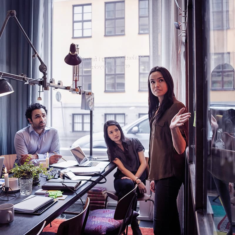 Creative businesswoman giving presentation in modern office