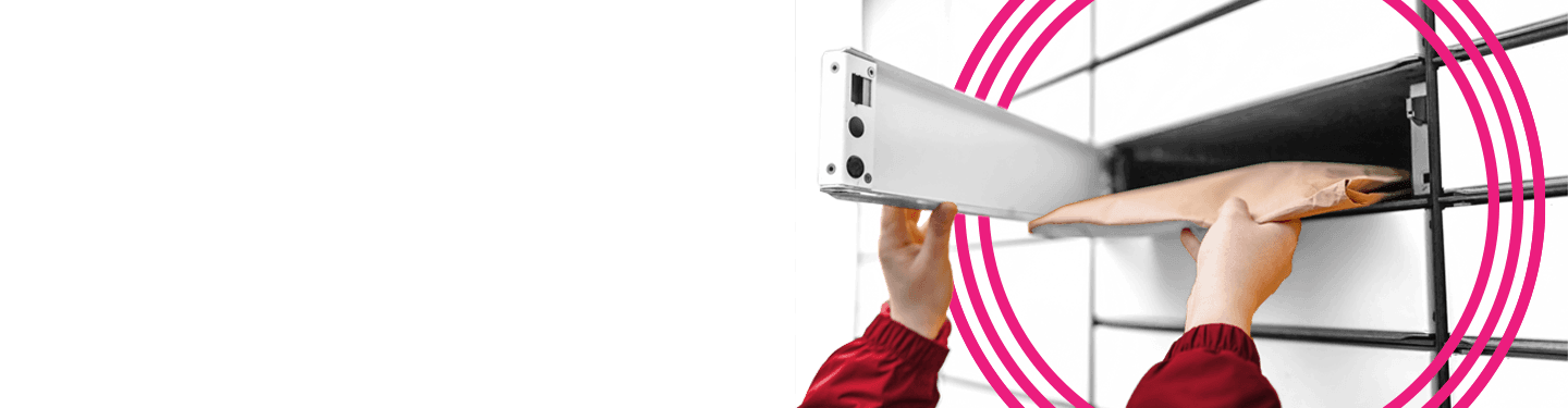 Hands taking our a package from a shipping locker