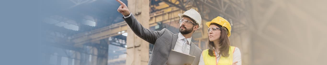Man and woman speaking in field environment