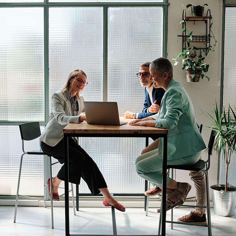 Professionals working, demonstrating how managed services team supports customer-contracted resources for Ricoh services, solutions, operations, and customer relations.