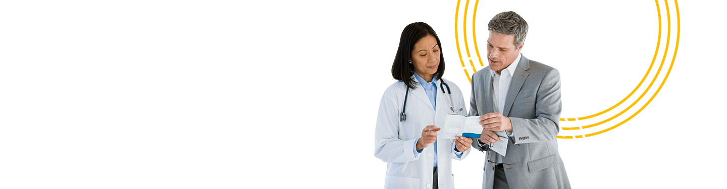 Doctor and business man talking over paperwork