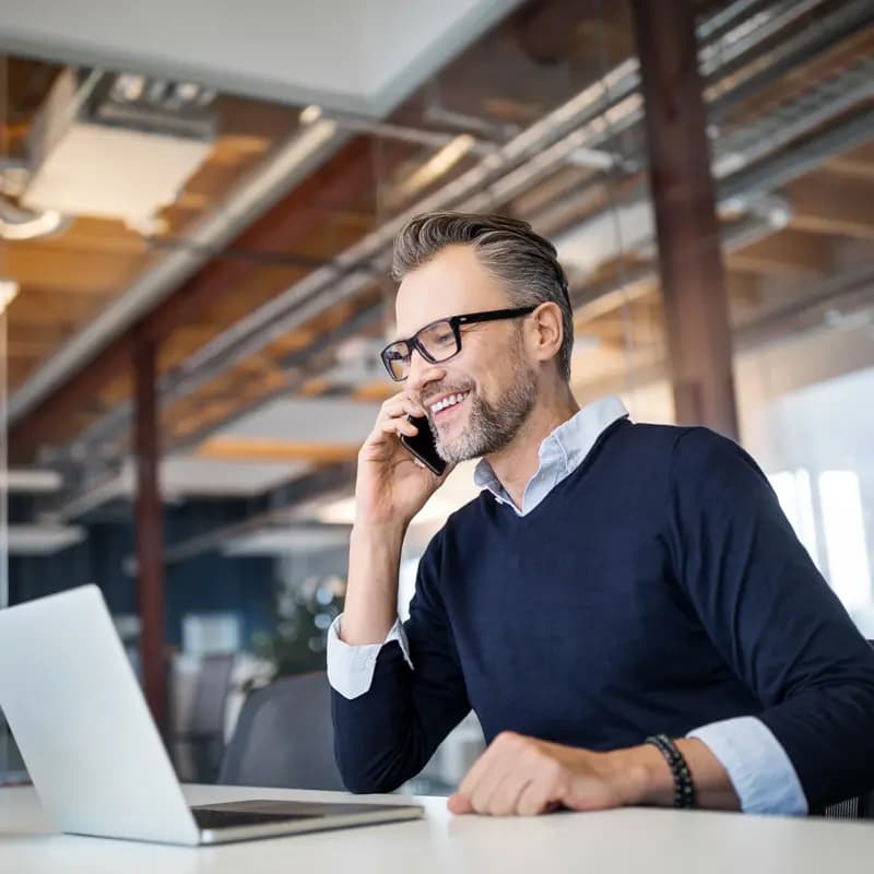 A man on a call, demonstrating inside sales positions