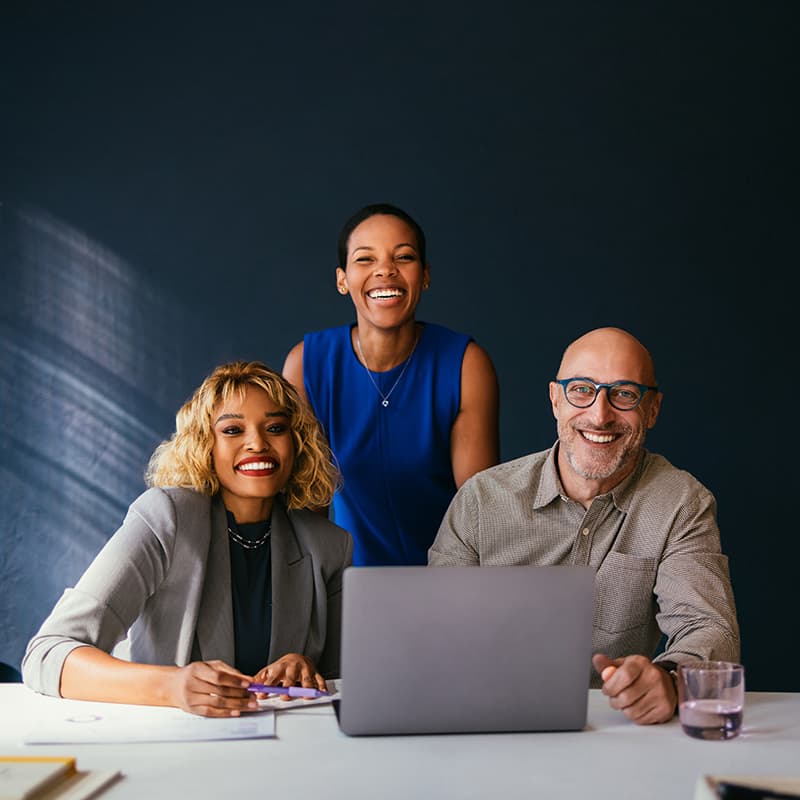 Three smiling professionals demonstrating Accounts Receivable and Cash Operations team