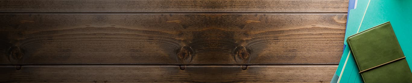 Stack of files on a wooden table